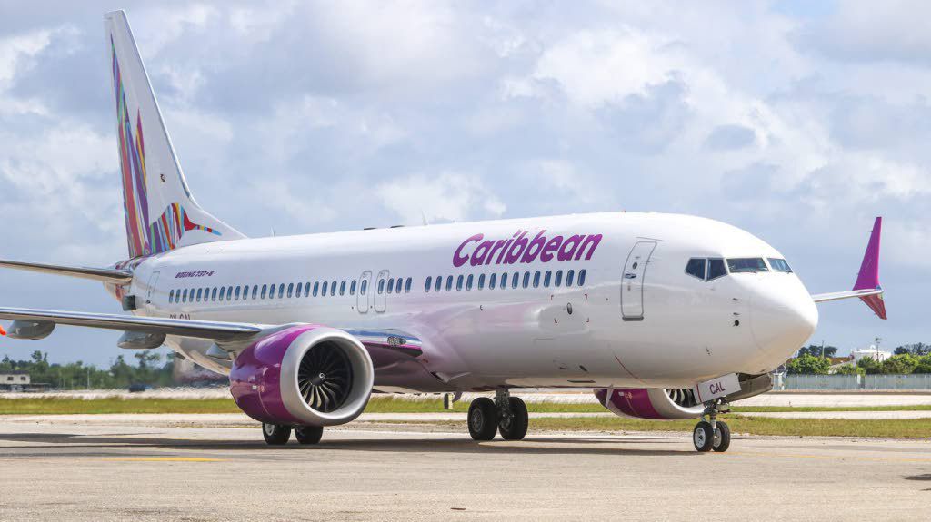 A Caribbean Airlines Boeing 737-8 on the tarmac at Piarco International Airport.  [Image by NISAR MOHAMMED]