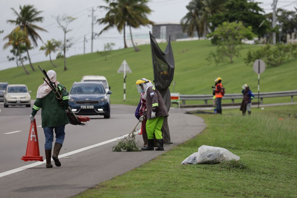 CEPEP crew clearing grass along the South Trunk Road in Bel Air, La Romain, earlier this year.