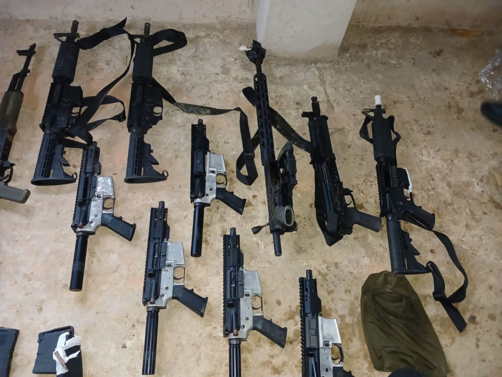 Cops find large cache of arms in South - Trinidad Guardian