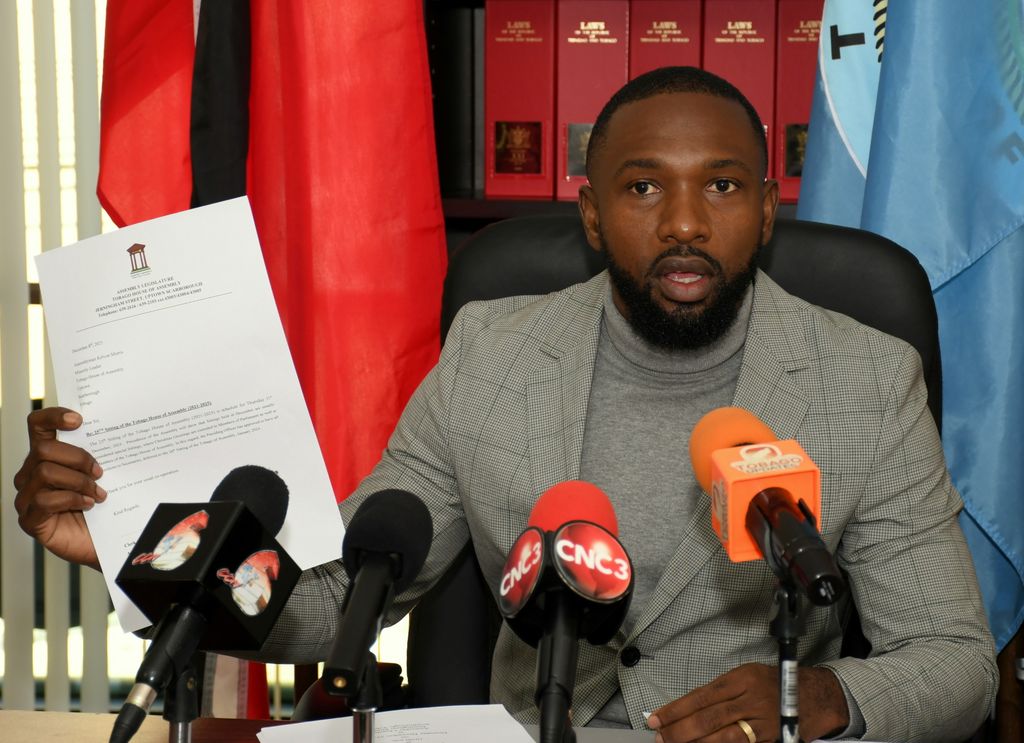 THA minority leader Kelvon Morris displays a letter from the Assembly Legislature Tobago House of Assembly as he addresses members of the media during a press conference on Monday.  