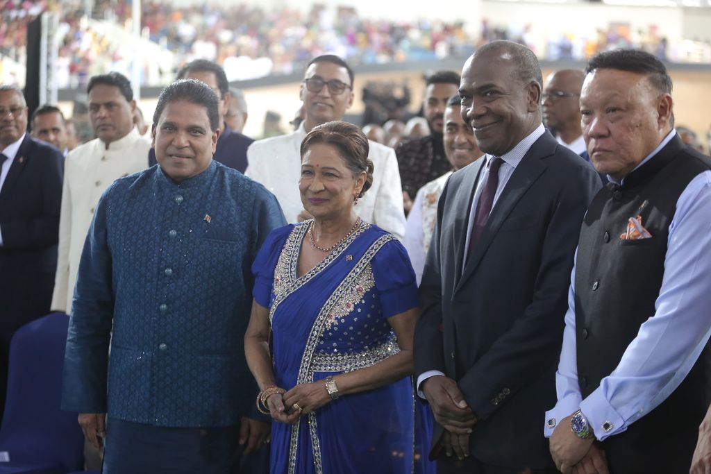 Prime Minister Kamla Persad-Bissessar with Government ministers, from left, Roodal Moonilal, John Jeremie and David Lee during the Community Diaspora Interaction with India Prime Minister Narendra Modi at the National Cycling Centre, Couva, last night.