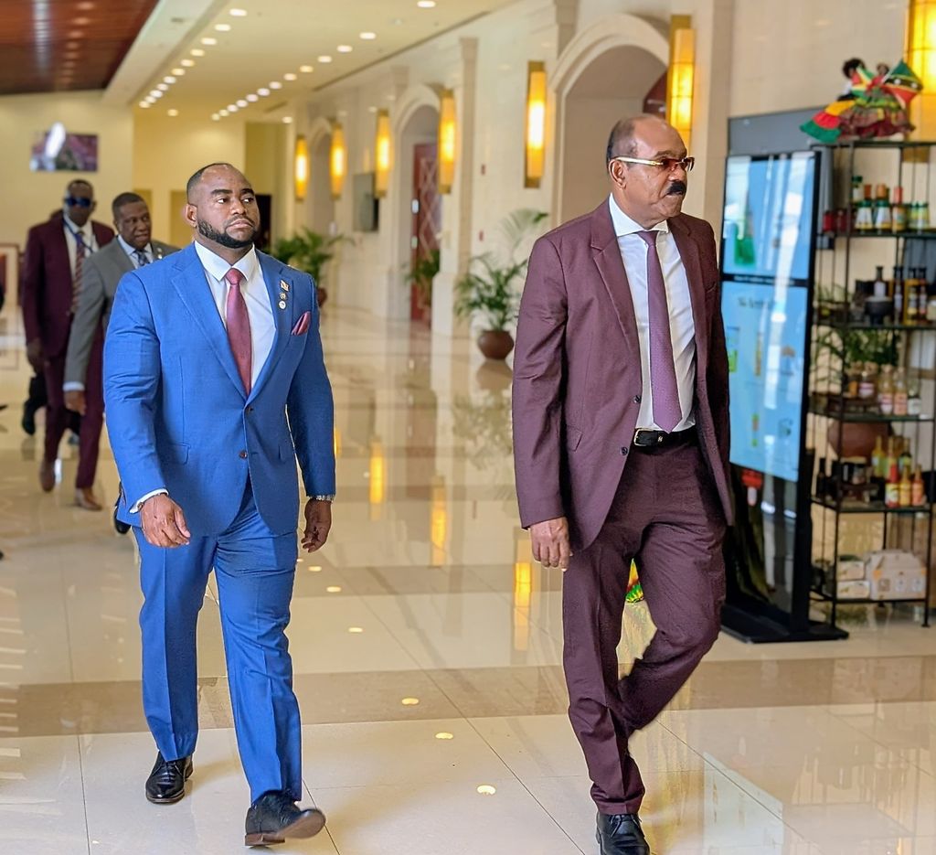 Antigua and Barbuda Prime Minister Gaston Browne, right, and Trinidad and Tobago Foreign and Caricom Affairs Minister Sean Sobers make their way to a plenary session at the 49th Regular Meeting of the Conference of Heads of Government of Caricom in Montego Bay, Jamaica, yesterday. 