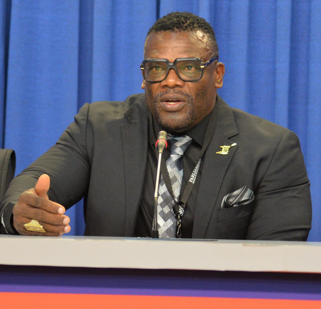 Homeland Security Minister Roger Alexander responds to questions during the post-cabinet press conference at the Diplomatic Centre, St Ann's yesterday.