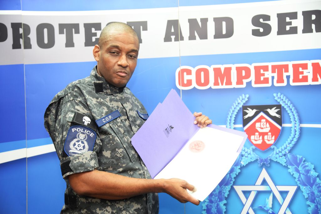 Police Commissioner Allister Guevarro is seen wearing a Punisher arm patch on his uniform while displaying a copy of the State of Emergency proclamation during a news conference last Friday at Police Administration Building, Port-of-Spain.