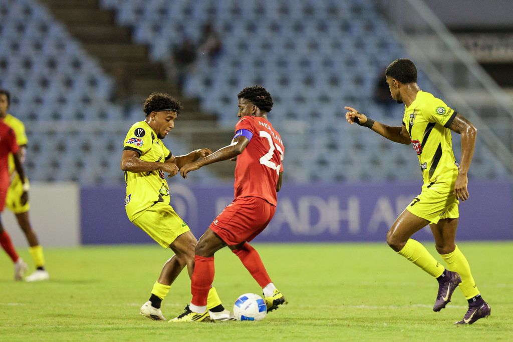 Central FC Jameel Neptune, centre, challenges Moca FC Guillermo De Peña for possession of the ball during 2025 Concacaf Caribbean Cup at the Hasely Crawford Stadium in Mucurapo, Port-of-Spain, last Tuesday. Central FC won 2-0.