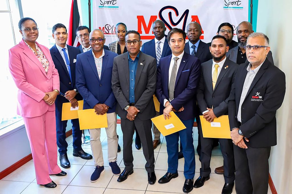 From left, Permanent Secretary (Ag) Beverly Reid-Samuel, Chairman of SporTT Kester Lendore, Minister of Sports and Youth Affairs, Phillip Watts, Deputy Chairman of SporTT Shaun Teekasingh, Adrian Ali, Director, and SporTT Chief Executive Officer, Jason Williams.